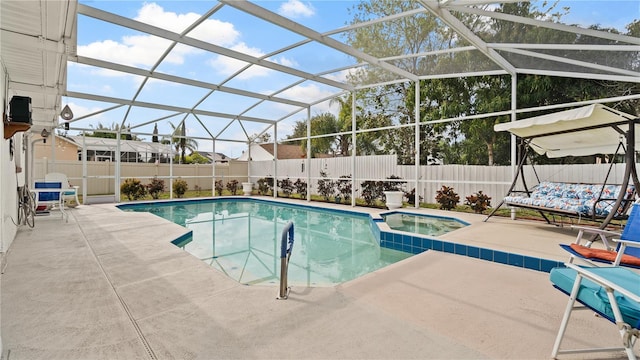 view of swimming pool with a patio area, an in ground hot tub, and glass enclosure