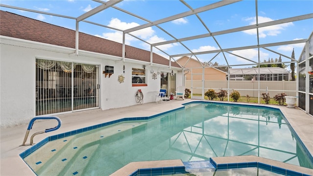 view of pool with a lanai and a patio area