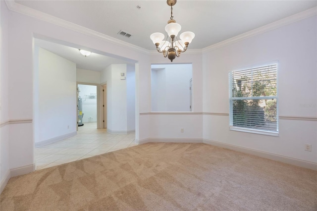 carpeted empty room with ornamental molding and a chandelier