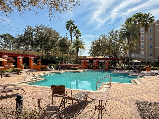 view of swimming pool featuring a patio area