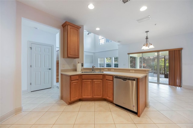 kitchen with light tile patterned flooring, sink, hanging light fixtures, dishwasher, and a notable chandelier