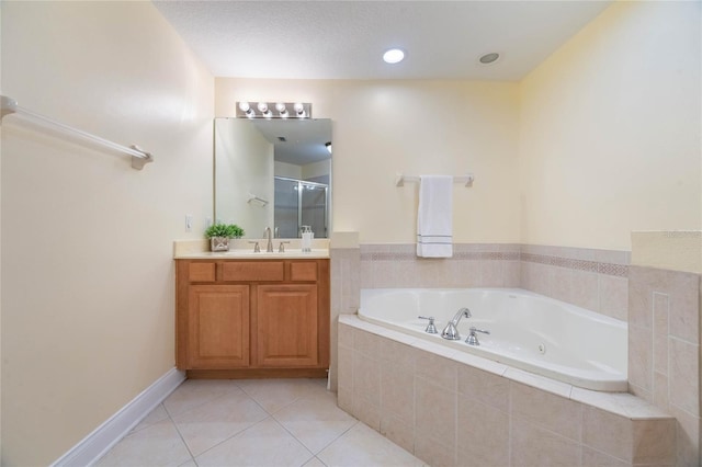 bathroom featuring vanity, tile patterned floors, and shower with separate bathtub