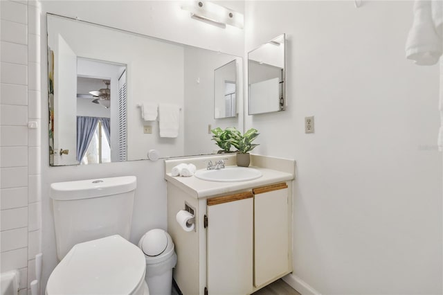 bathroom with ceiling fan, vanity, and toilet