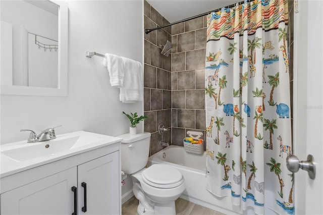 full bathroom featuring shower / tub combo with curtain, vanity, and toilet