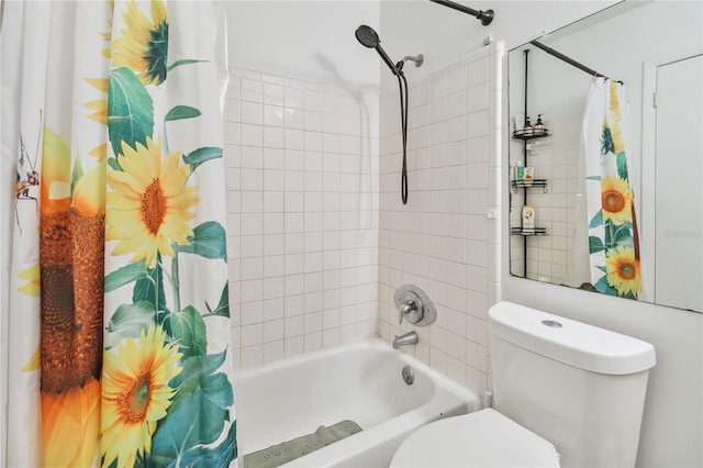 bathroom featuring shower / bath combination with curtain and toilet