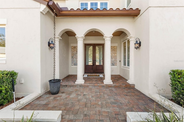 entrance to property featuring french doors