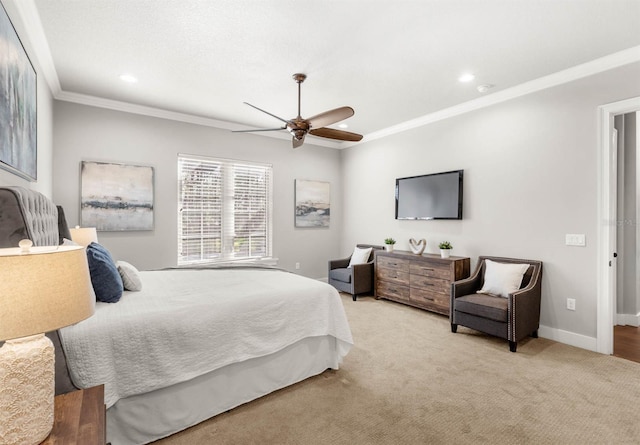 bedroom with crown molding, ceiling fan, and light carpet