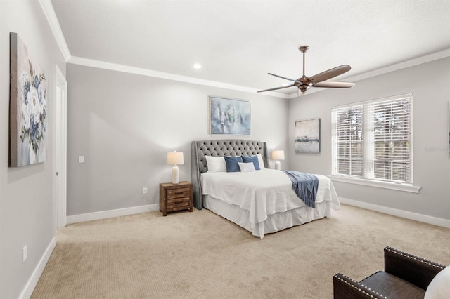 carpeted bedroom featuring crown molding and ceiling fan