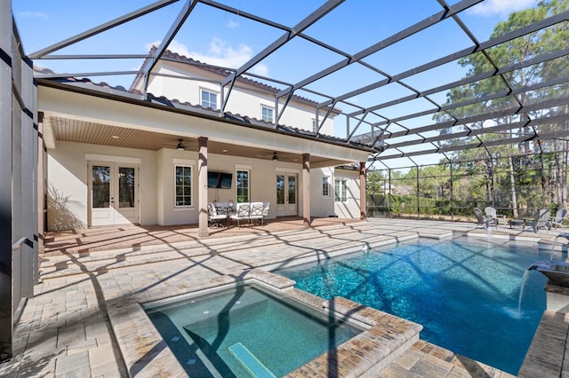 view of swimming pool with a patio, french doors, ceiling fan, and glass enclosure