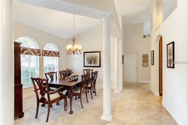 tiled dining space with a notable chandelier, decorative columns, and high vaulted ceiling