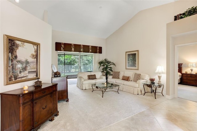 living room with high vaulted ceiling and light colored carpet