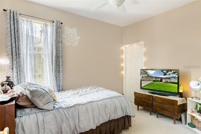 carpeted bedroom featuring ceiling fan