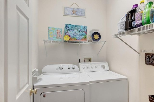 laundry room with washer and clothes dryer