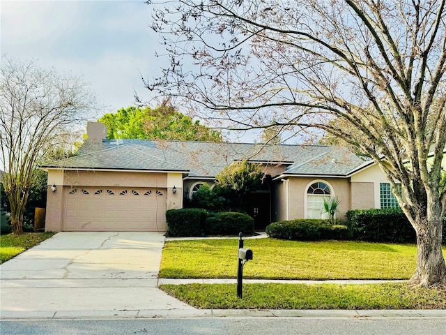 ranch-style house with a garage and a front lawn