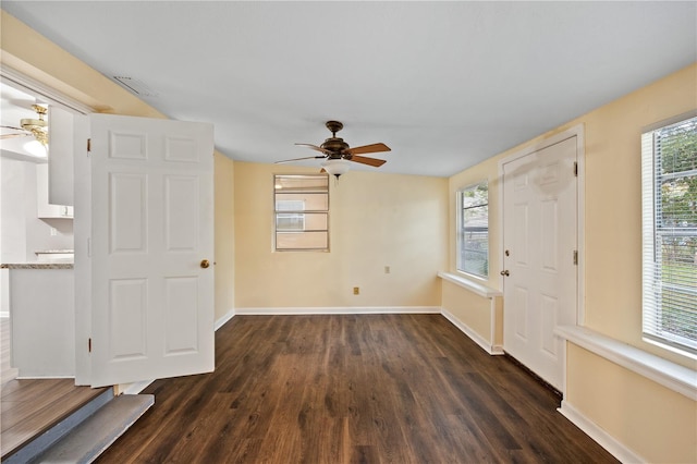 entrance foyer featuring baseboards, dark wood-type flooring, and ceiling fan