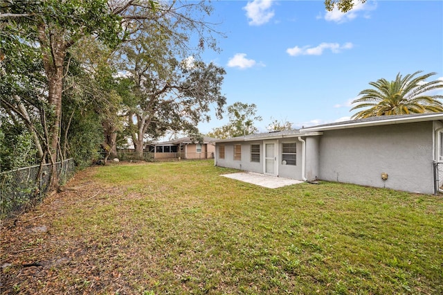 view of yard featuring a patio and a fenced backyard