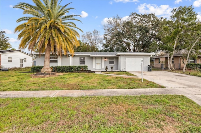 ranch-style home featuring a garage, driveway, a front yard, and stucco siding