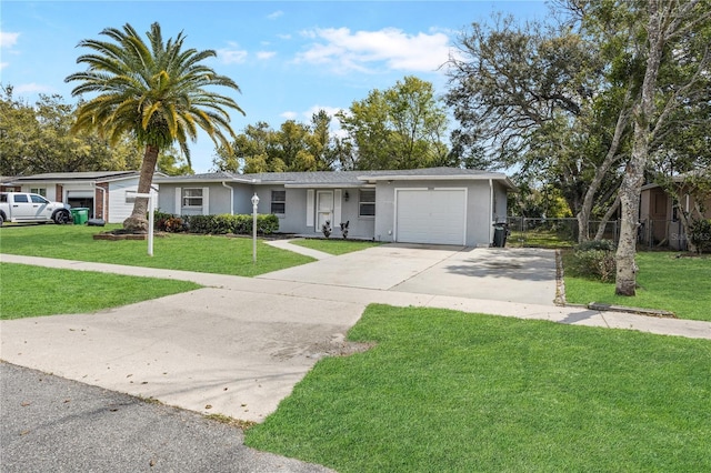 ranch-style home featuring stucco siding, driveway, a front lawn, and an attached garage