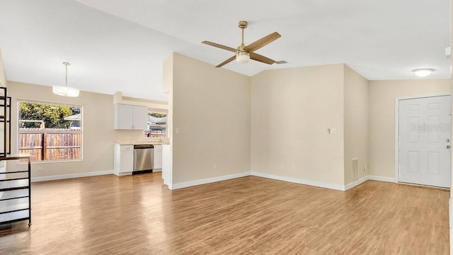 unfurnished living room with light hardwood / wood-style floors, lofted ceiling, and ceiling fan