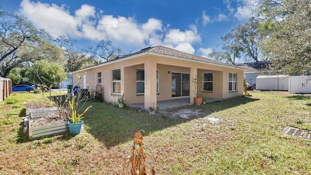 back of house with a yard