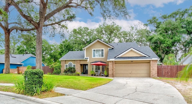 view of front of home featuring a garage and a front yard