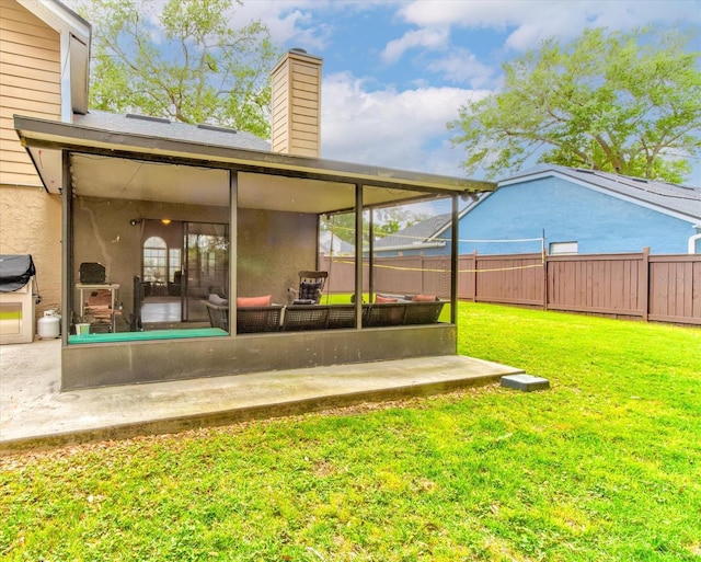 exterior space featuring a sunroom and fence