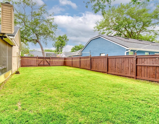view of yard featuring a fenced backyard