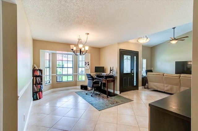 office space with light tile patterned floors, baseboards, vaulted ceiling, a textured ceiling, and ceiling fan with notable chandelier