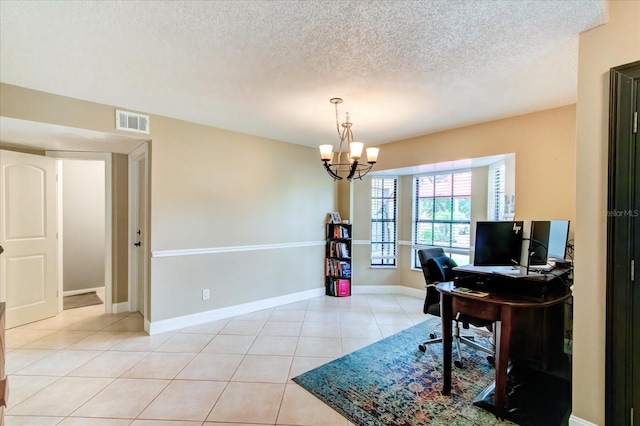 office area with baseboards, visible vents, a textured ceiling, a notable chandelier, and light tile patterned flooring