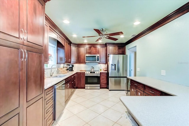 kitchen featuring a sink, stainless steel appliances, light tile patterned floors, and light countertops