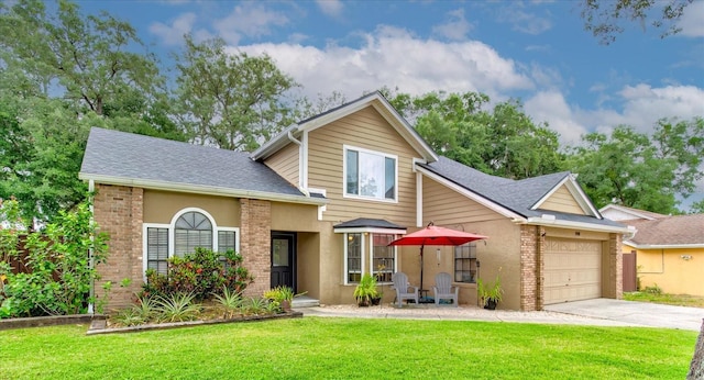 view of front facade featuring a garage, concrete driveway, brick siding, and a front lawn