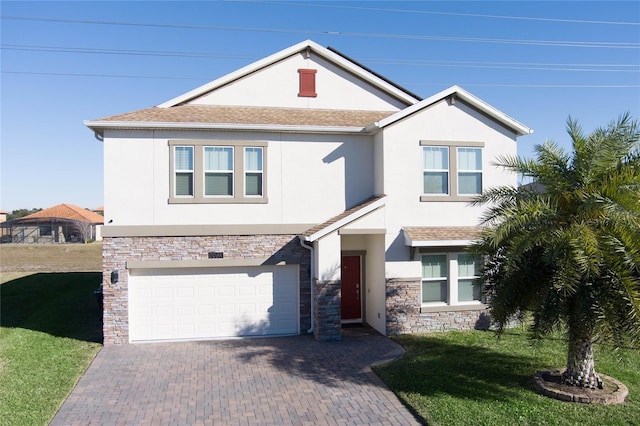 view of front of house featuring a garage and a front yard