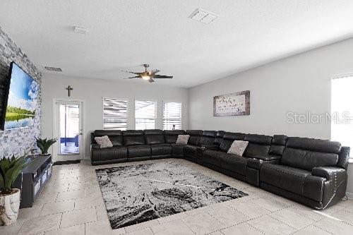 living room featuring a textured ceiling