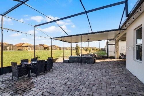 view of patio / terrace with an outdoor living space and a lanai