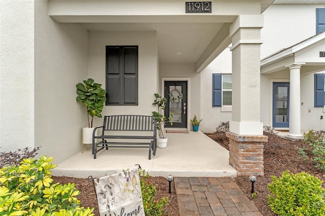 property entrance featuring covered porch