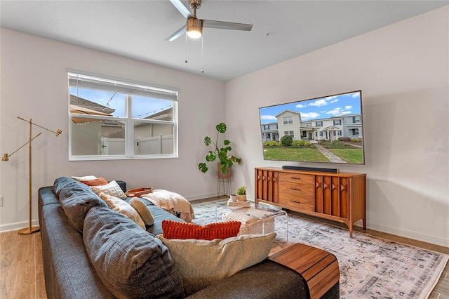 living room with ceiling fan and hardwood / wood-style floors