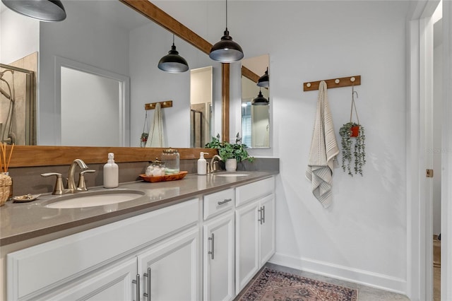 bathroom with vanity and a shower with shower door