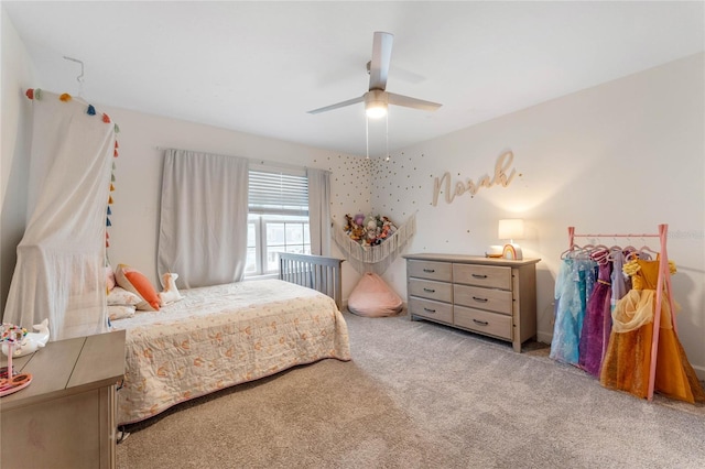 bedroom featuring light carpet and ceiling fan