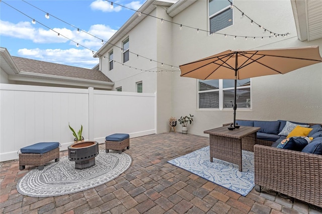 view of patio / terrace featuring an outdoor living space with a fire pit