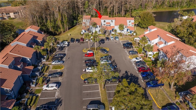 birds eye view of property with a water view