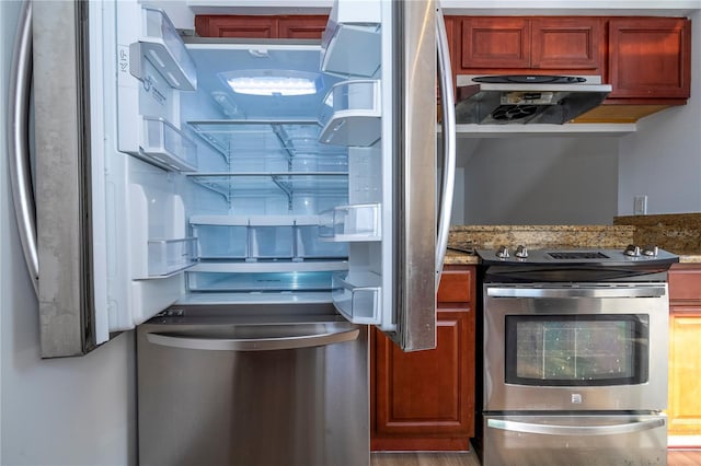 kitchen featuring stainless steel appliances, stone countertops, and exhaust hood