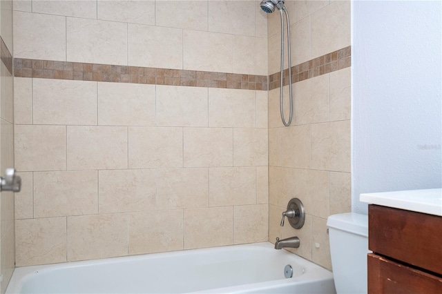 full bathroom with vanity, toilet, and tiled shower / bath combo