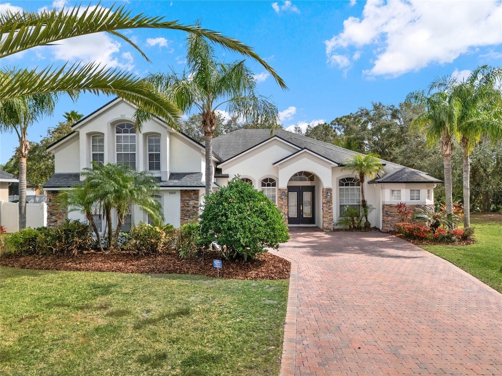 view of front of property featuring french doors and a front yard