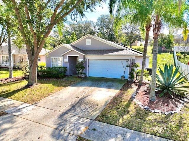 view of front of house with a garage and a front lawn