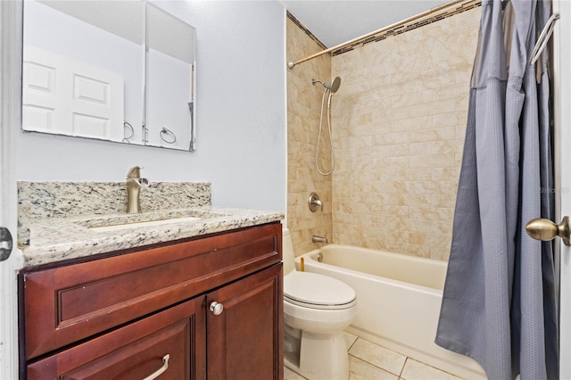 full bathroom featuring vanity, shower / tub combo with curtain, tile patterned floors, and toilet