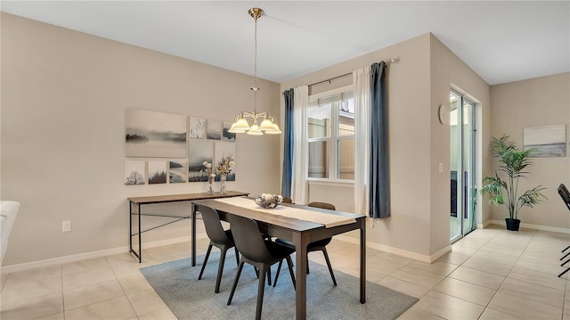 dining area with a notable chandelier and light tile patterned floors