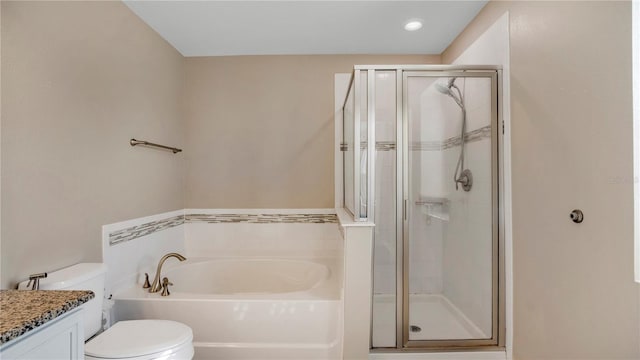 full bathroom featuring vanity, toilet, and separate shower and tub