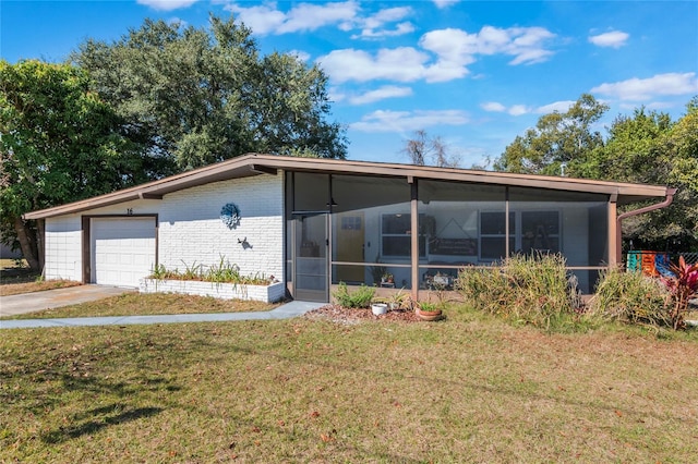 view of front of house with a sunroom and a front lawn