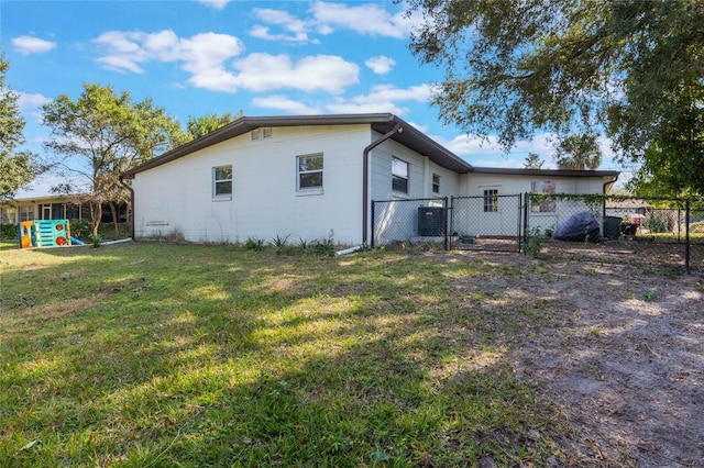 exterior space with a yard, a gate, and fence