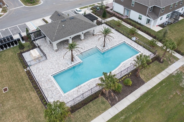 view of swimming pool with a yard, a pergola, and a patio area